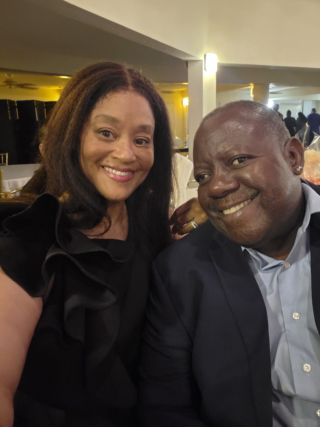 Paul and Kalyn, smiling together at a party